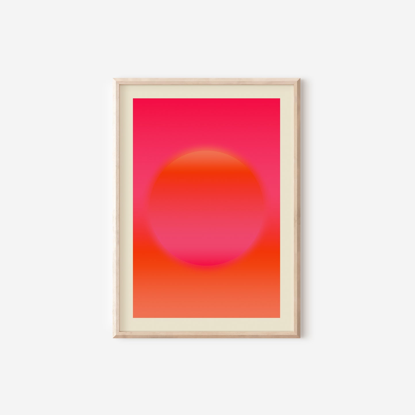 a pink and orange poster hanging on a wall