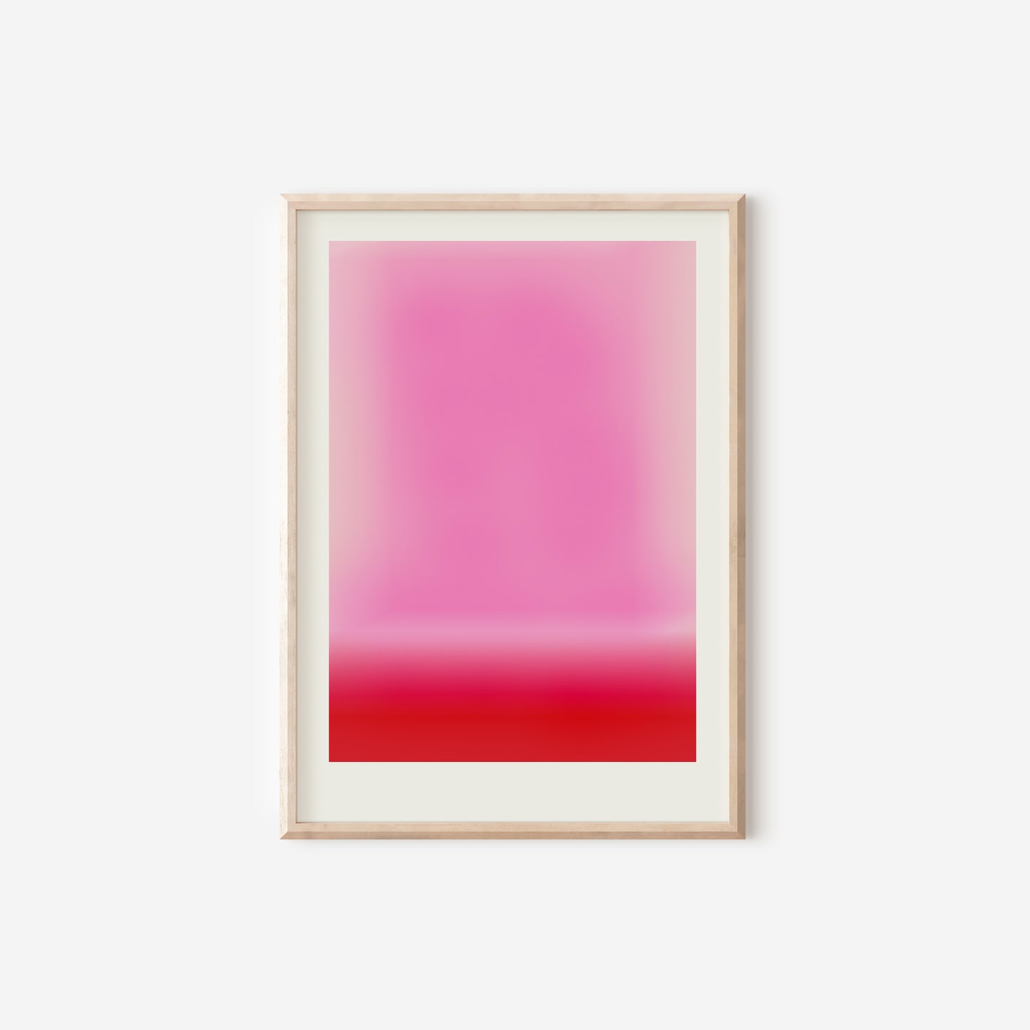 a pink and red painting hanging on a wall