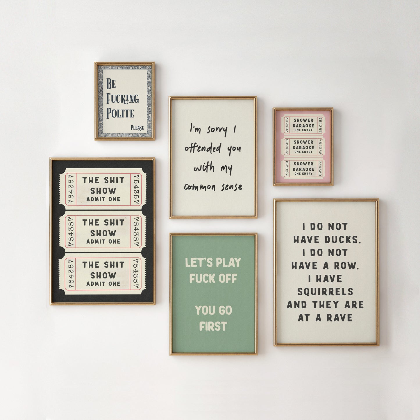 a bunch of framed pictures hanging on a wall