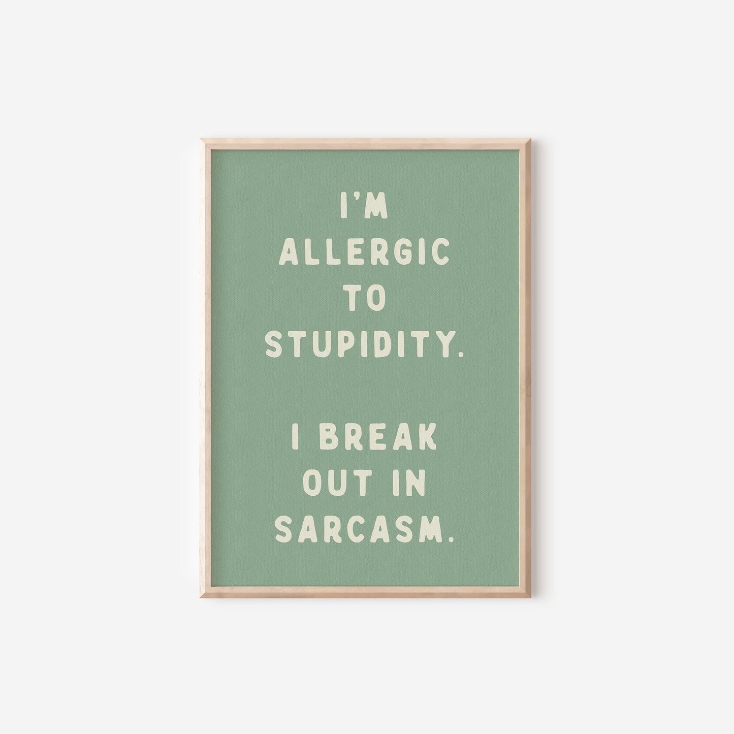 a green poster with the words i'm allergic to stupidity,