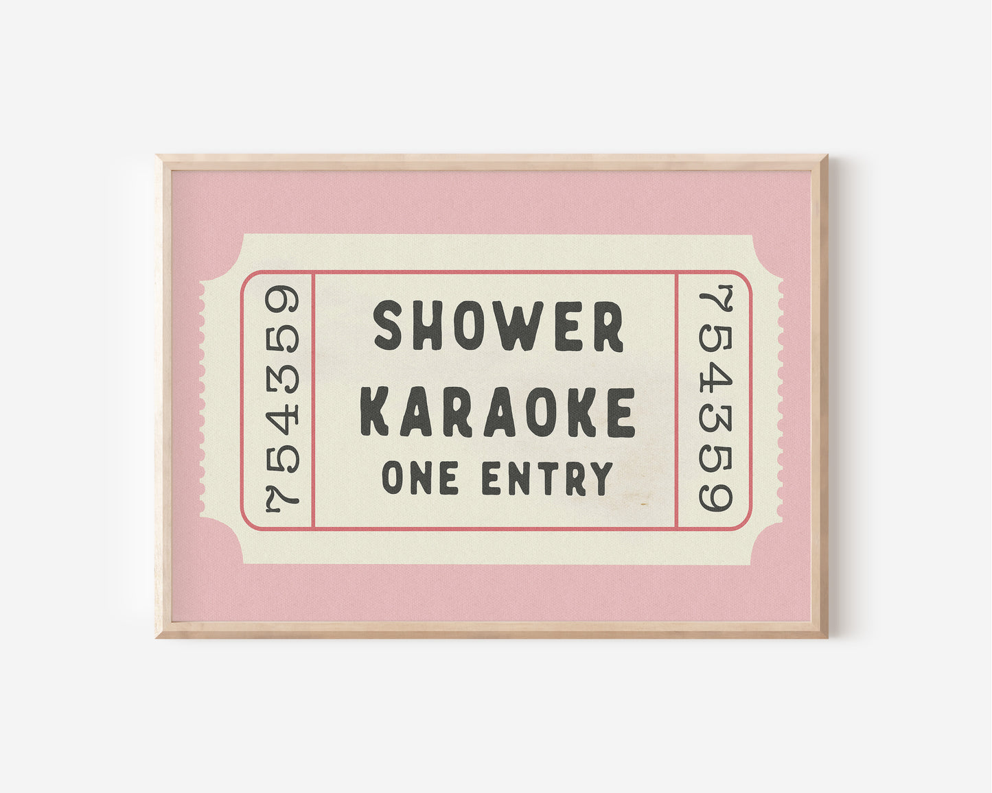 a pink and white framed movie ticket on a wall