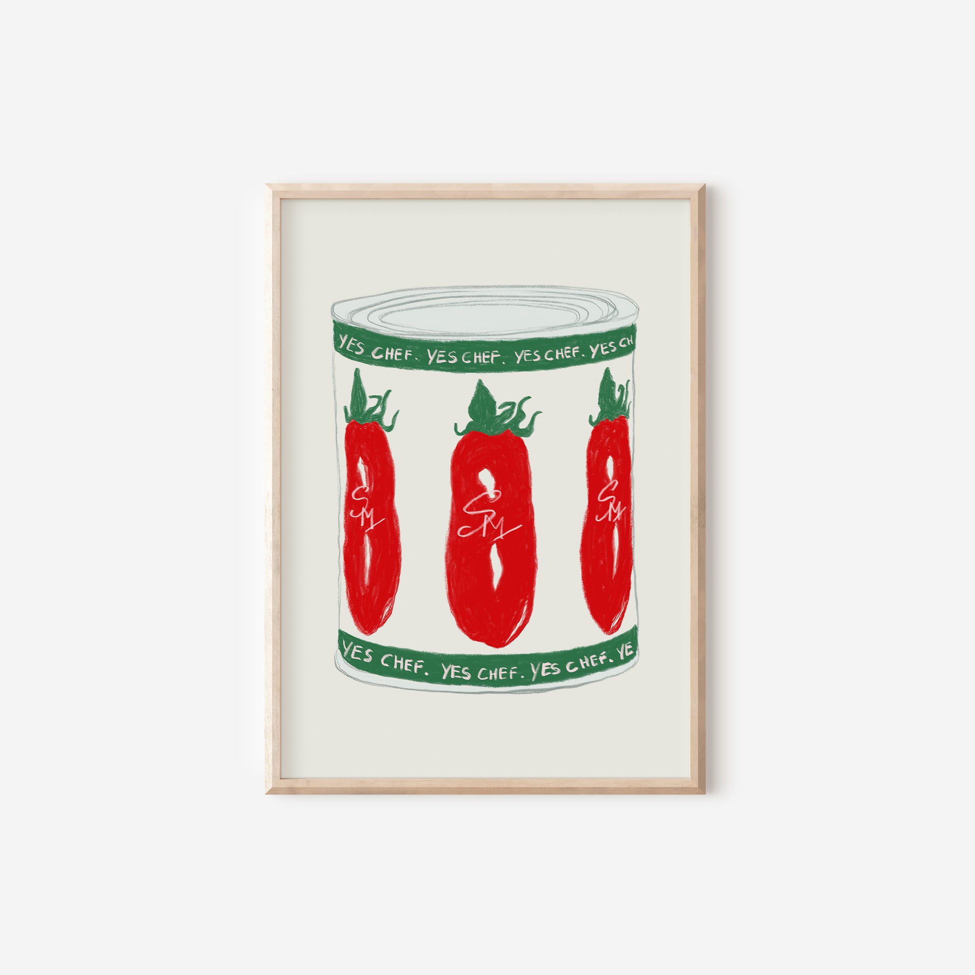 a framed print of three red peppers in a jar
