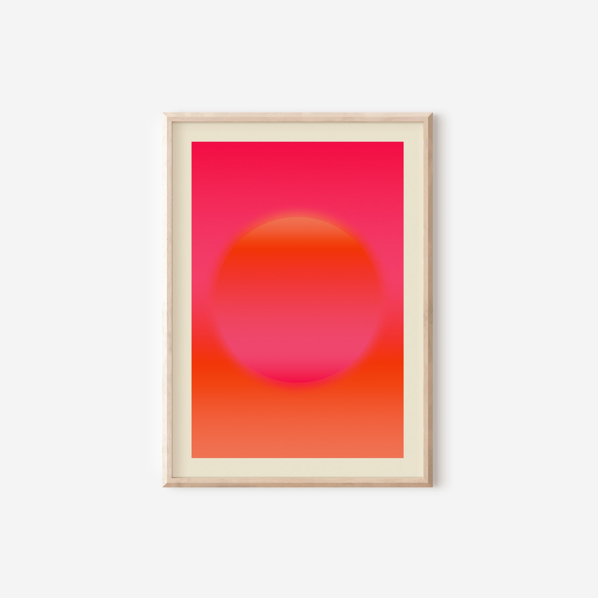 a pink and orange poster hanging on a wall