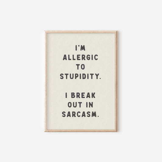 a black and white print with the words i'm allergic to stupid