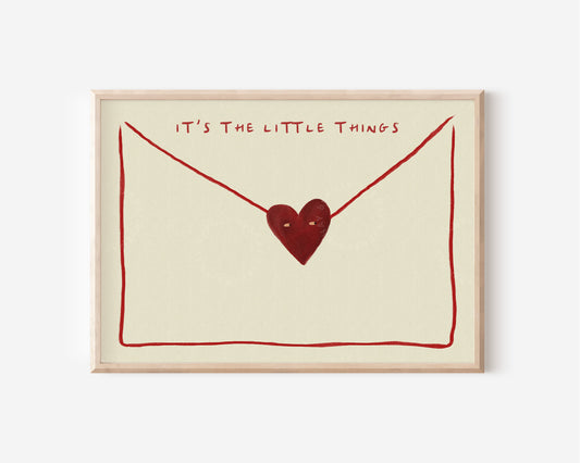 The image is a framed print with a heart-shaped symbol and the text "IT'S THE LITTLE THINGS" written above it.