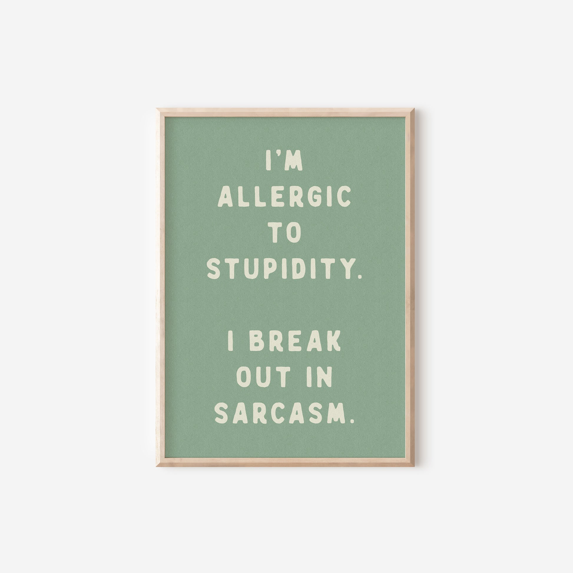 a green poster with the words i'm allergic to stupidity,