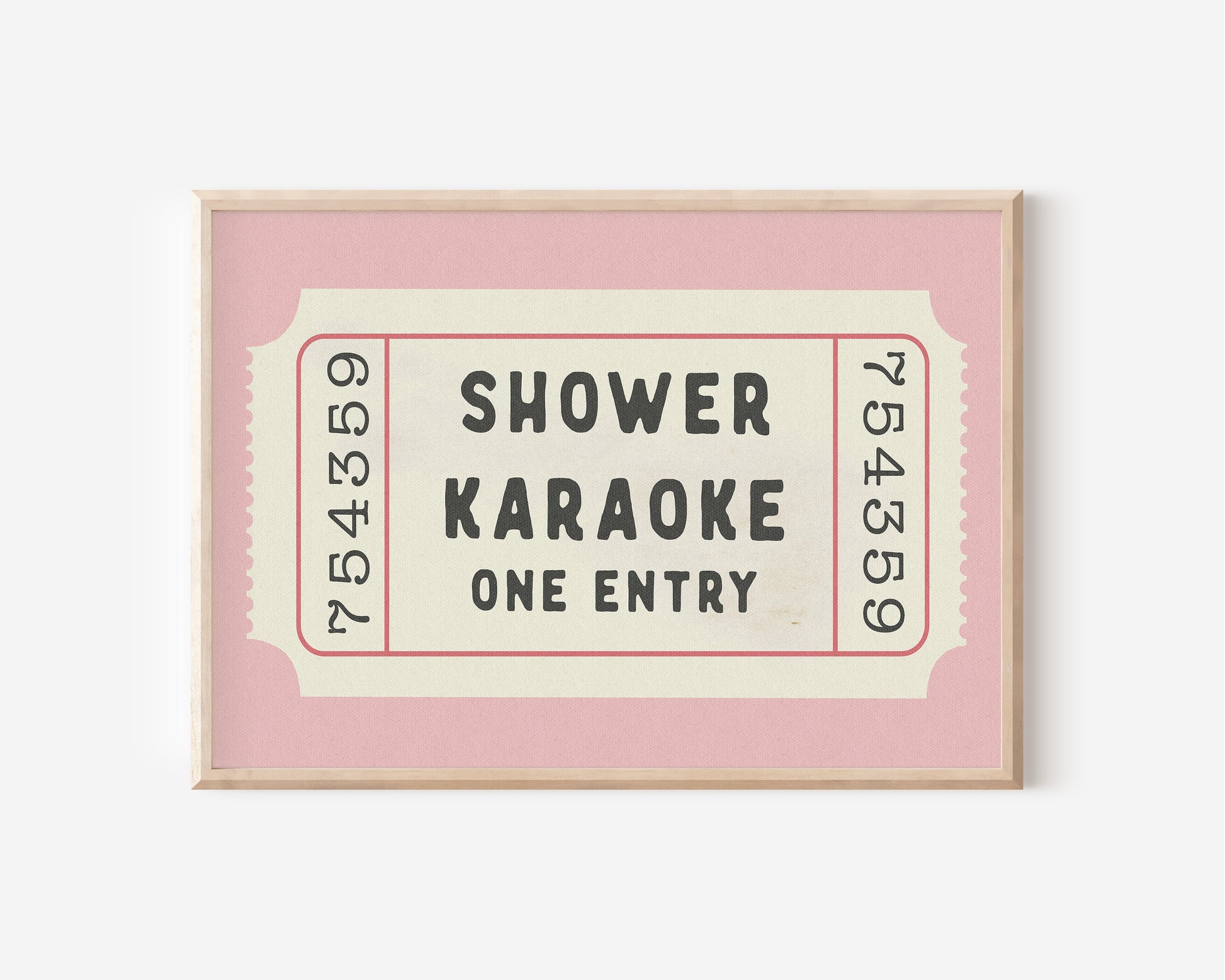 a pink and white framed movie ticket on a wall
